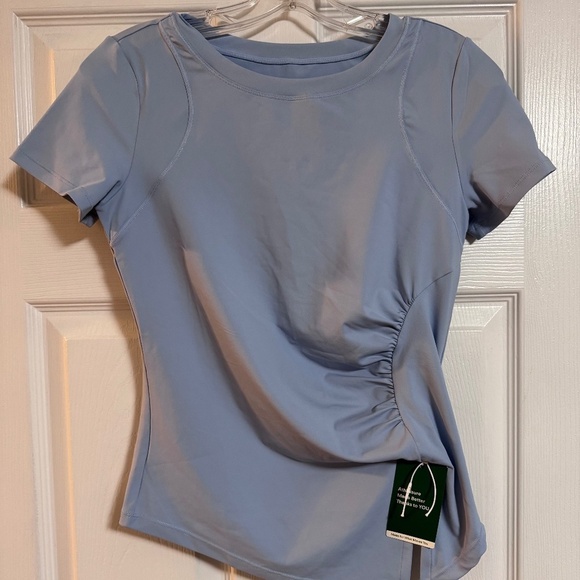 HALARA Tops - NWT HALARA light blue tee Size Xs.